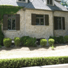 Cottage board & batten style PVC shutters. Made in Canada by Columns Plus.